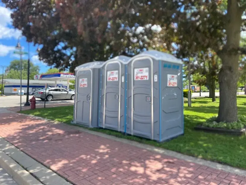 MP Sanitation standard units staged along Sheridan Road in Zion, IL
