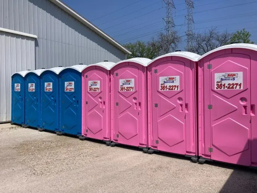 Clean blue and pink MP Sanitation standard portable toilets ready for delivery in Lake County, IL
